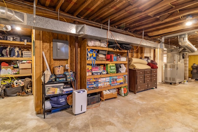 basement with heating unit and electric panel