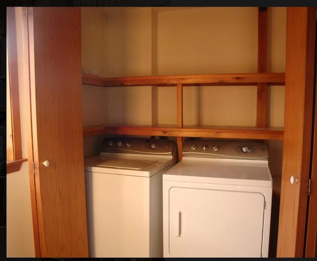 washroom featuring independent washer and dryer