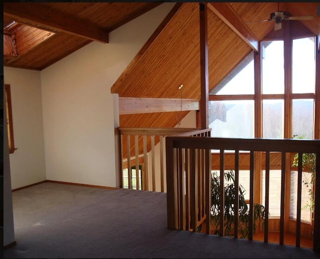 additional living space featuring ceiling fan, beam ceiling, high vaulted ceiling, carpet, and wooden ceiling