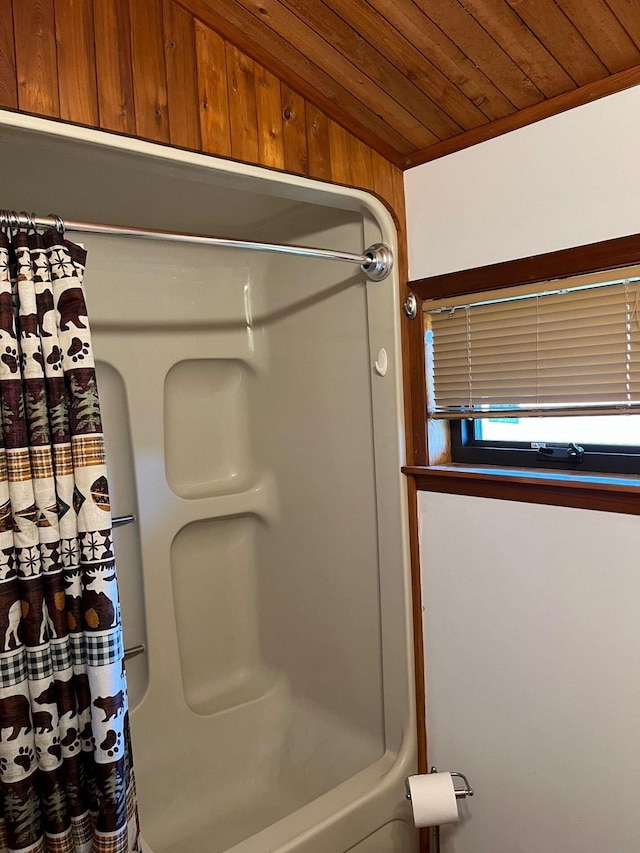 bathroom featuring shower / bath combo and wood ceiling