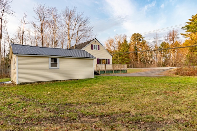 exterior space with a lawn and a deck