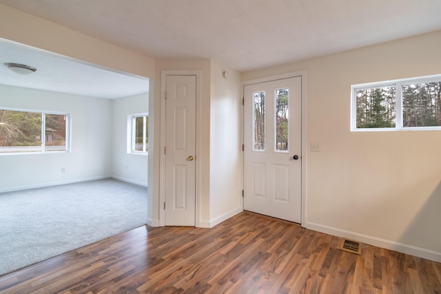 entrance foyer featuring dark hardwood / wood-style floors