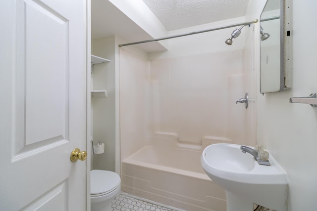 full bathroom with shower / bathtub combination, toilet, sink, and a textured ceiling