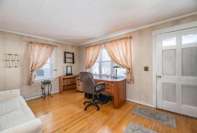 office area with baseboard heating, ornamental molding, and light hardwood / wood-style flooring