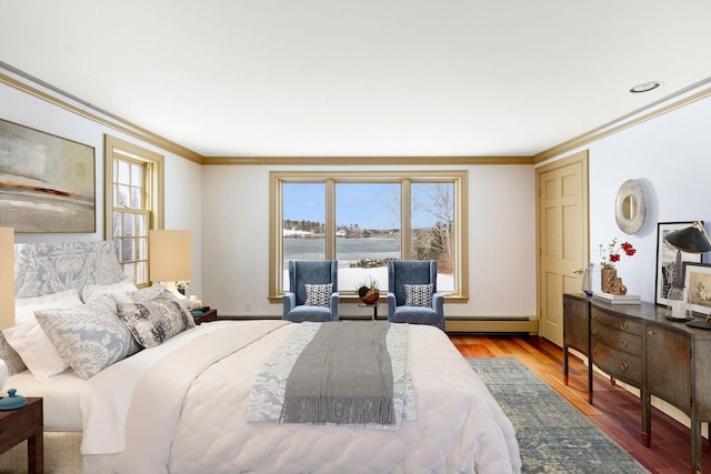 bedroom with a baseboard radiator, multiple windows, ornamental molding, and wood finished floors