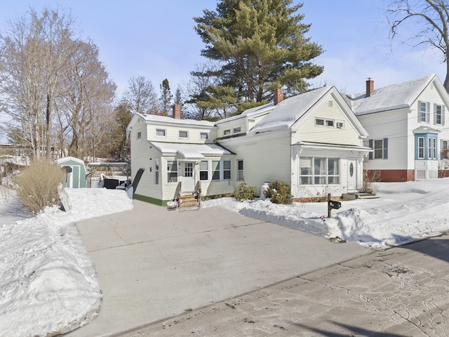 view of snow covered house