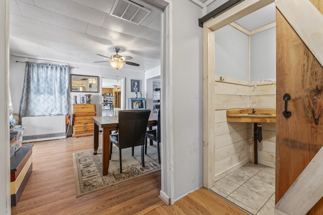 dining space featuring ceiling fan and light hardwood / wood-style flooring