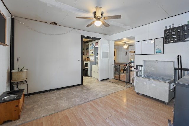 interior space with ceiling fan and light wood-type flooring