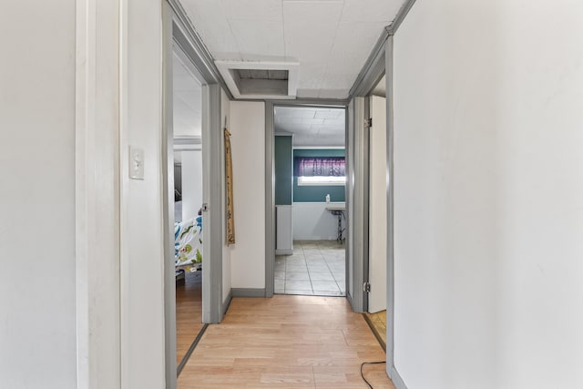 hall with light hardwood / wood-style flooring