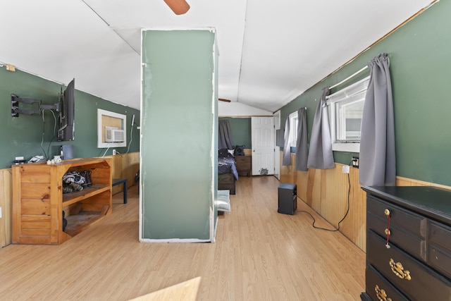 interior space featuring lofted ceiling and light wood-type flooring