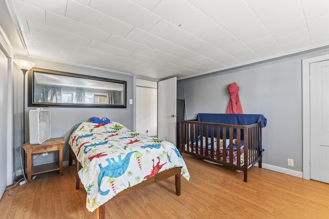 bedroom with hardwood / wood-style flooring