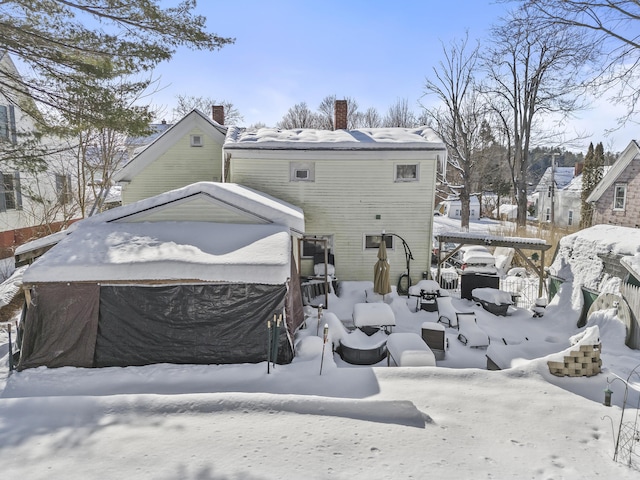 view of snow covered house