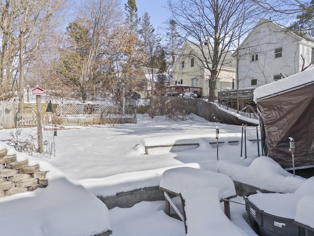 view of yard layered in snow