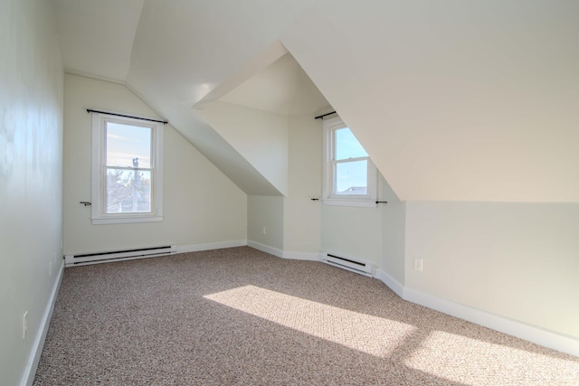 bonus room with baseboard heating, lofted ceiling, and carpet