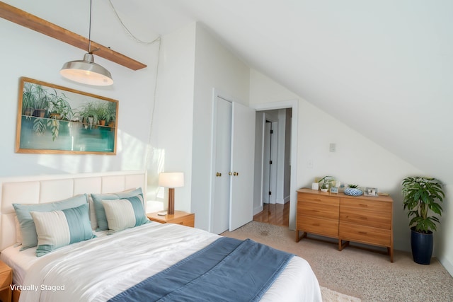 bedroom featuring light carpet and vaulted ceiling