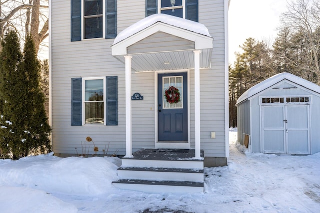 view of snow covered property entrance