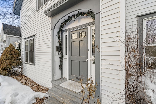 view of snow covered property entrance