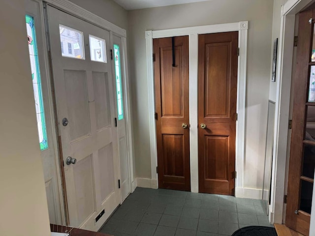 foyer entrance with baseboards