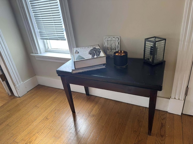 details with wood finished floors and baseboards