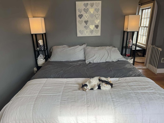 bedroom featuring wood finished floors