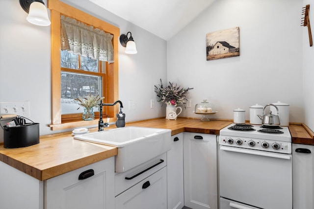 kitchen with wood counters, sink, and white range with electric cooktop