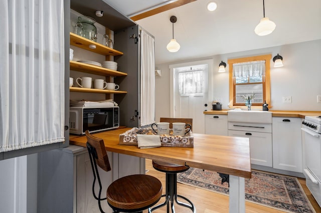 interior space featuring sink and light wood-type flooring