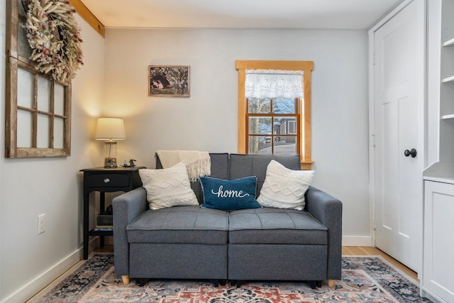 living area with hardwood / wood-style floors