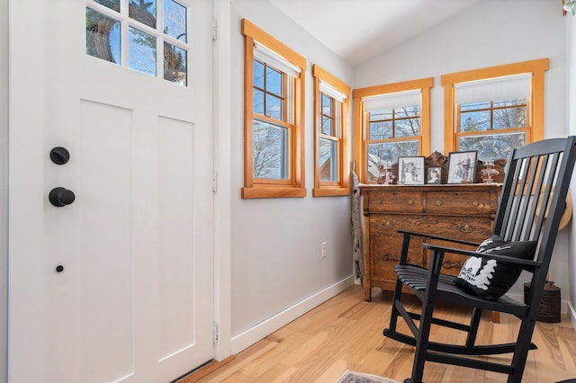 sitting room featuring light hardwood / wood-style floors and lofted ceiling