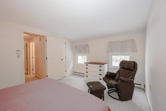 bedroom with a baseboard heating unit, a baseboard radiator, baseboards, and light colored carpet