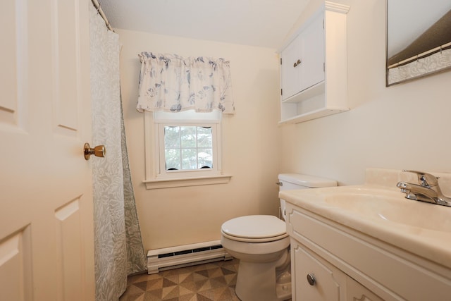 bathroom with baseboard heating, vanity, and toilet