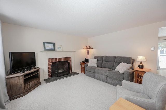 living area featuring carpet and a fireplace