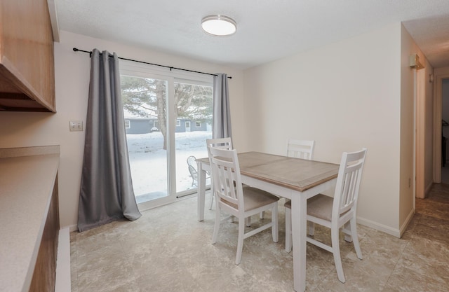 dining space with baseboards