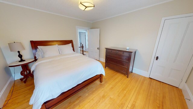 98 Fountain St, Bangor, ME 04401 - bedroom with ornamental molding and light hardwood / wood-style floors