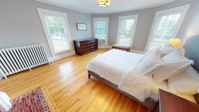 98 Fountain St, Bangor, ME 04401 - bedroom with hardwood / wood-style floors, crown molding, and radiator heating unit