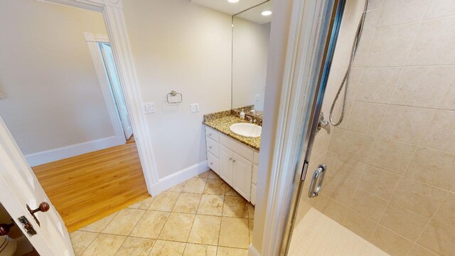 98 Fountain St, Bangor, ME 04401 - bathroom with walk in shower, tile patterned floors, and vanity