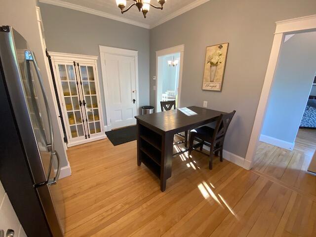98 Fountain St, Bangor, ME 04401 - office with crown molding, light hardwood / wood-style floors, and a notable chandelier