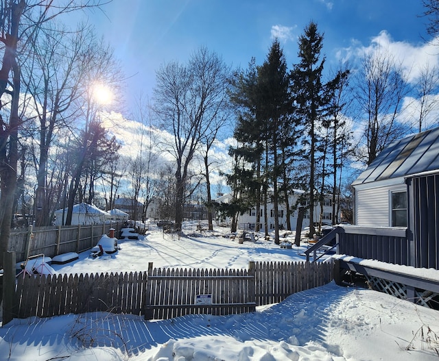 view of yard covered in snow