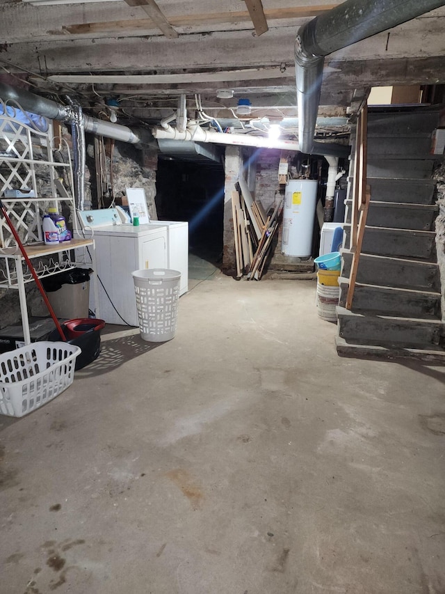 basement featuring independent washer and dryer and electric water heater