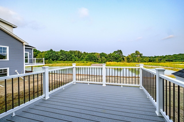 wooden deck with a water view