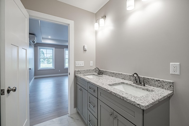 bathroom featuring vanity and a wall mounted AC