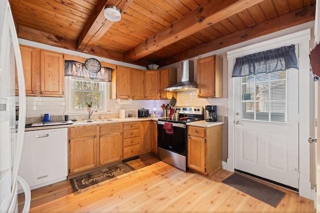 kitchen with sink, light hardwood / wood-style flooring, stainless steel electric range, white refrigerator, and wall chimney range hood