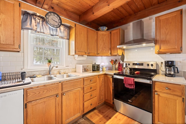 kitchen featuring sink, electric range, beam ceiling, white dishwasher, and wall chimney exhaust hood