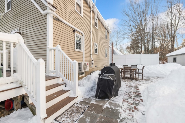 view of snow covered exterior featuring ac unit