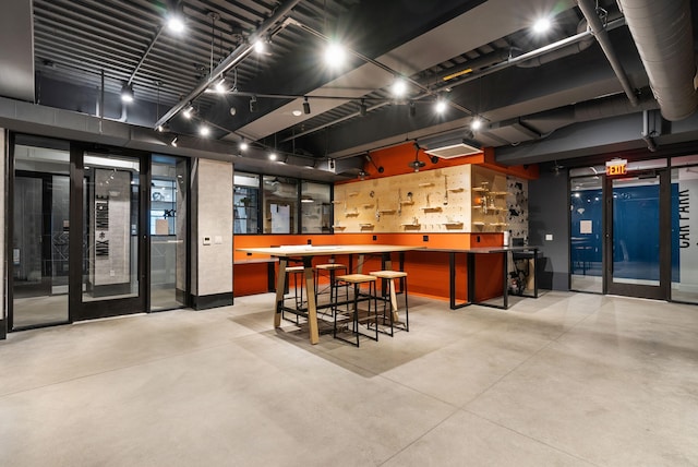 bar with concrete flooring