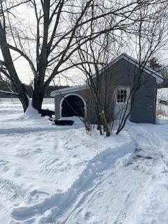 view of yard covered in snow