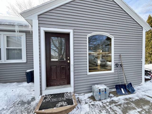 view of snow covered property entrance