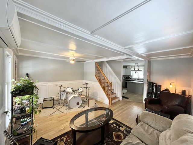 living room featuring ceiling fan and light hardwood / wood-style floors