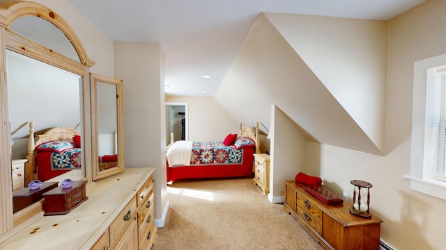 bedroom with light carpet and lofted ceiling