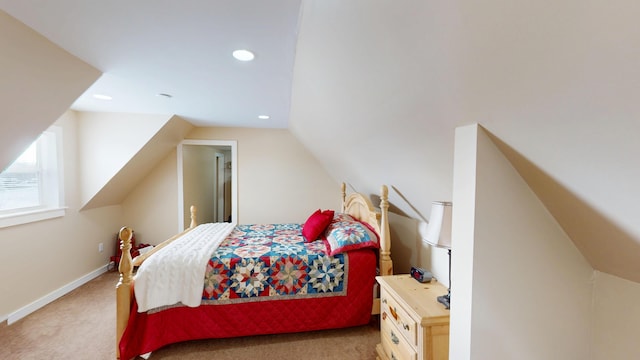 carpeted bedroom featuring lofted ceiling