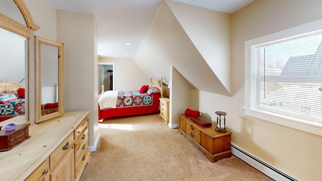 bedroom featuring a baseboard radiator, vaulted ceiling, and light carpet